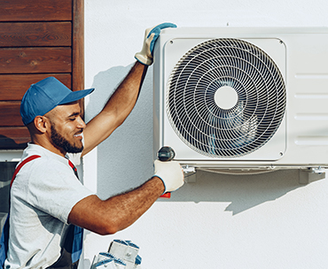 Man working on aircone outside