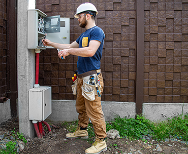 Man installing new wiring on Electrical system